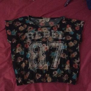 A floral “Rebel 87” cropped shirt